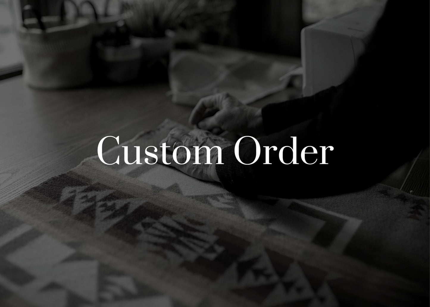 Person working on a custom order with text overlay 'Custom Order' in a blurred indoor setting.