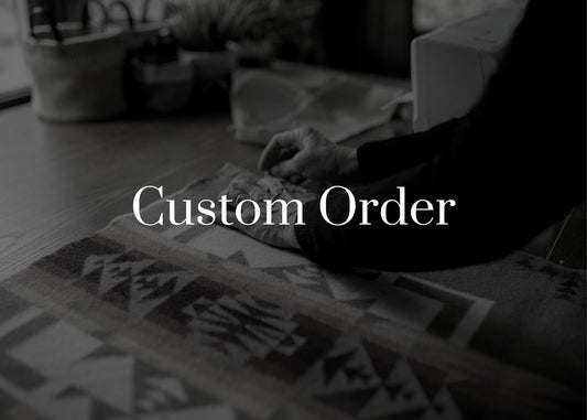 Person working on a custom order with text overlay 'Custom Order' in a blurred indoor setting.