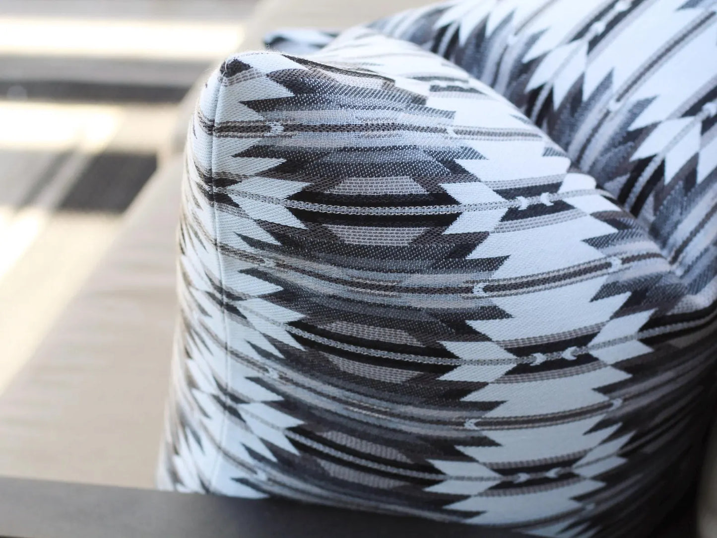 Close up of outdoor pillow in the black, gray, and white southwestern Wyeth Trail Stone pattern